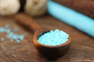 Spa concept. Wooden spoon with sea salt, close up