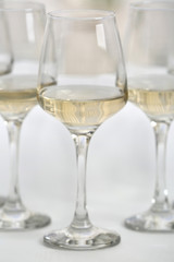 Glasses of white wine on table closeup