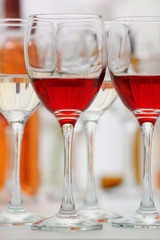 Wine glasses with red and white wine, closeup