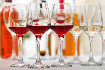 Wine glasses with red and white wine, closeup