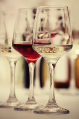 Wine glasses with red and white wine, closeup