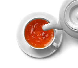 Cup of tea and teapot, isolated on white