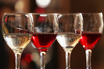 Glasses of red and white wine closeup