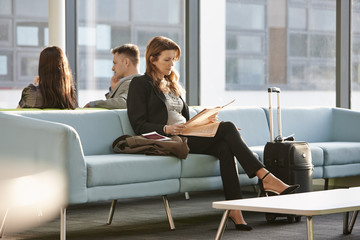 Businesswoman in departure lounge