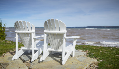 Muskoka Chairs by the water's edge for scenic view
