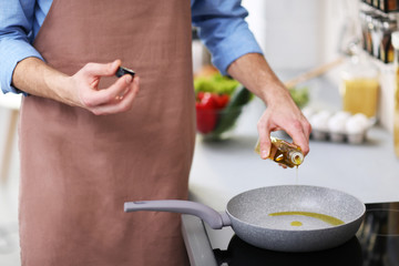 Man cooking in kitchen