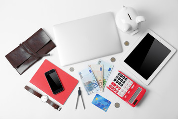 Business concept. Gadgets and money on office table, top view