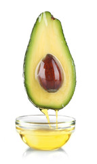 Fresh avocado and oil isolated on white background © Africa Studio