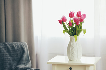 Bouquet of pink tulips in a vase, close up