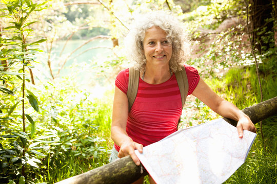 Woman with map, The Blue Pool, Wareham, Dorset, United Kingdom