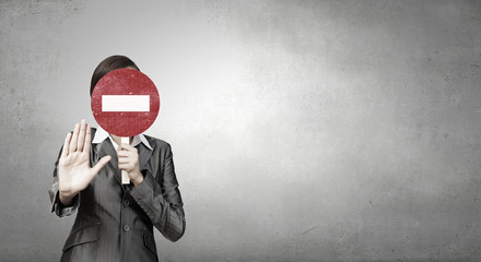 Businesswoman showing stop card