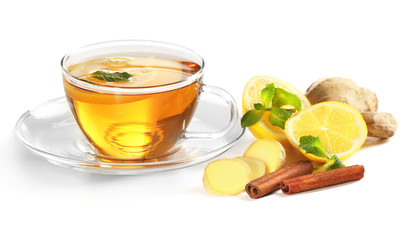 Cup of tea with ginger and cinnamon isolated on white