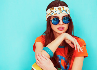 Beautiful hippie girl portrait smoking and wearing sunglasses