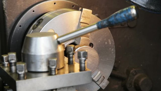 Operator measuring dimensions with calipers on milling machine.Operator measuring dimensions with a micrometer.Close up industrial metal machining cutting process