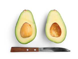 Avocado and knife isolated on white