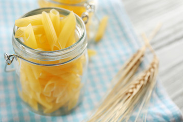 Raw pasta on checkered napkin closeup