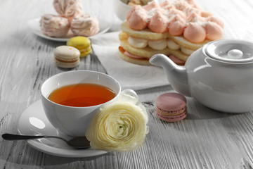 Cup of tea with delicious cakes