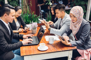 business people busy working with team at a cafe
