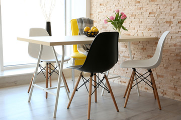 Dining table with set of chairs.