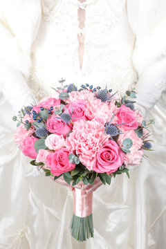 Pink bridal bouquet of roses and carnations