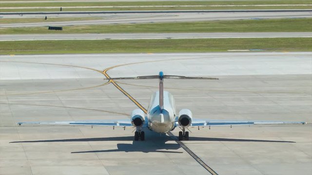 Regional Jet Airliner Passenger Commercial Airplane on Taxiway seen from Behind getting ready for Departure at George Bush Intercontinental Airport IAH in Houston Texas TX