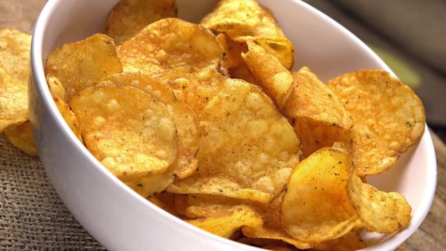 Potato Chips as seamless loopable 4K footage (close-up shot)