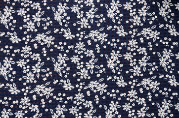 pattern little flowers on blur cloth fabric.
