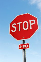 stop sign against blue sky