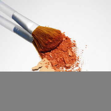 Foundation and blusher with make up brush