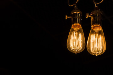 Vintage Edison Light Bulbs hanging against a black background