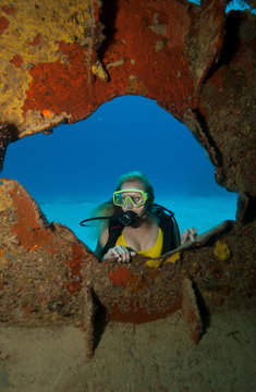 Scuba diver on shipwreck.