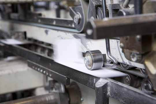 Close up of machine in cardboard factory