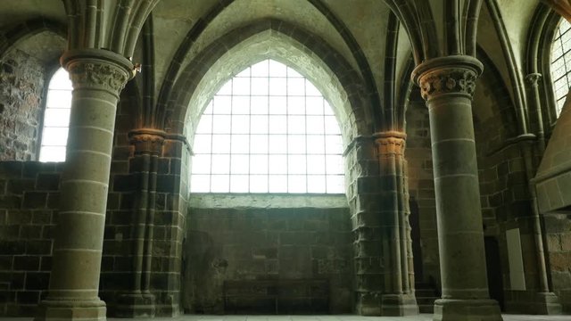 Beautiful interios of Mont Saint Michel island located in Normandy France 4K 3840X2160 UHD video - Mt Saint Michel famous UNESCO heritage interior columns and ceiling arcs 4K 2160p UHD footage 
