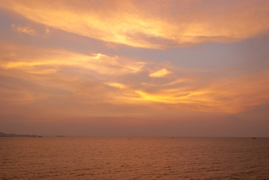 sky at sunset with ocean as background