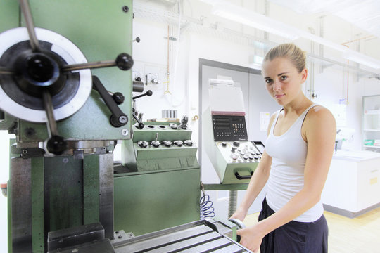 Technician working in mechanical workshop within optical laboratory