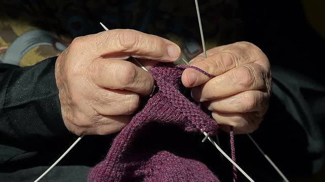 Closeup of a Grandmother Knitting Wool