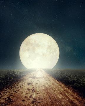 Beautiful countryside road with Milky Way star in night skies, full moon - Retro style artwork with vintage color tone(Elements of this moon image furnished by NASA)