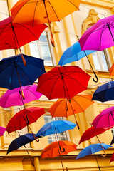 Fototapeta na wymiar Colorful umbrellas on the street