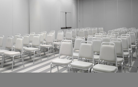 White chairs in empty auditorium