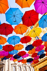 Fototapeta na wymiar Colorful umbrellas on the street
