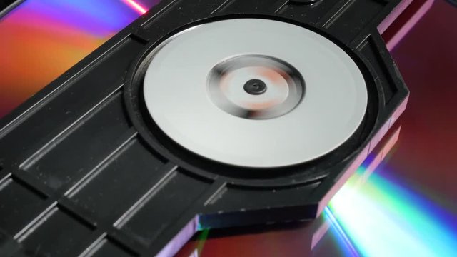 Compact disc medium inserting in player mechanism 4K 2160p UltraHD footage - DVD disk in medium player 4K 3840X2160 UHD video 