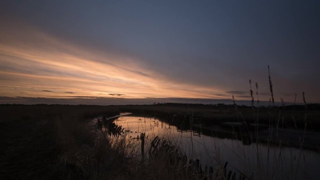 Sunset Time Lapse Clouds River Reflections - 4K Dolly Shot