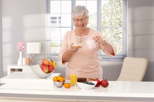 Happy Old Woman Eating Healthy