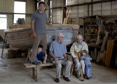 Group portrait of four generations of male boat builders