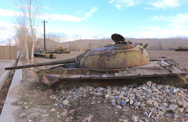 Tank abandoned in the middle of potato field