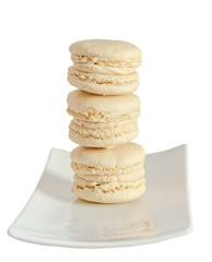 Coffee sweet macaroons, french traditional, cream,  white plate, close up, isolated on a white background