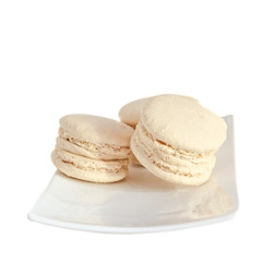 Coffee sweet macaroons, french traditional, cream,  white plate, close up, isolated on a white background