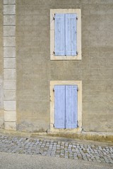 beautiful facade of a house with two windows, Languedoc, France