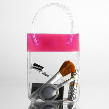 Make up and brushes in transparent bag