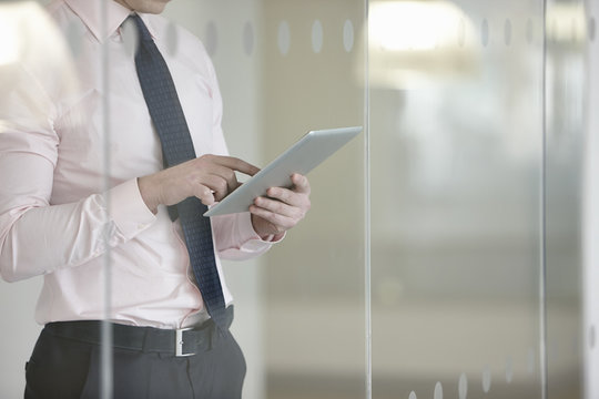 Businessman suing digital tablet